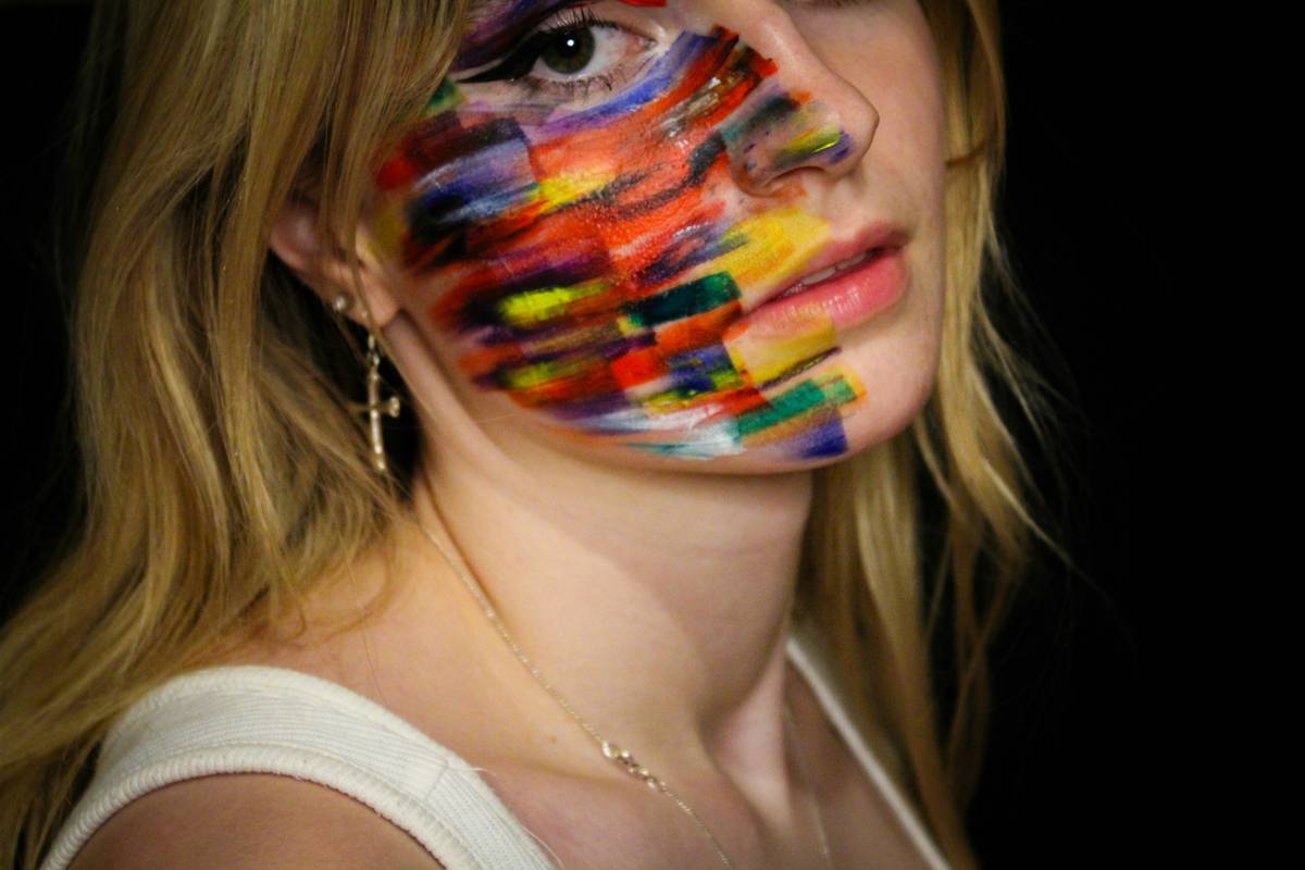 Model showcasing breakthrough makeup styles with dewy skin and bold graphic eyeliner